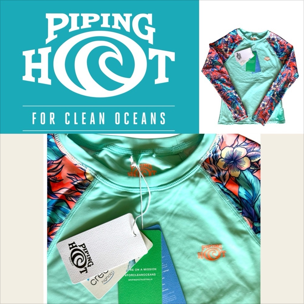Piping Hot brand rash guard features a mint green.
Size 12